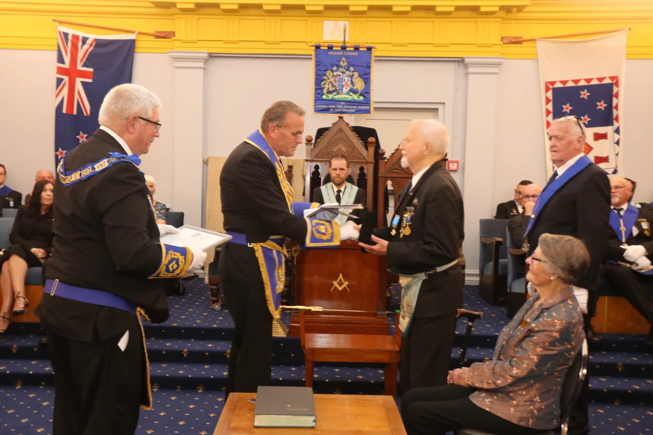 A presentation to Graham Richards, with his wife looking on
