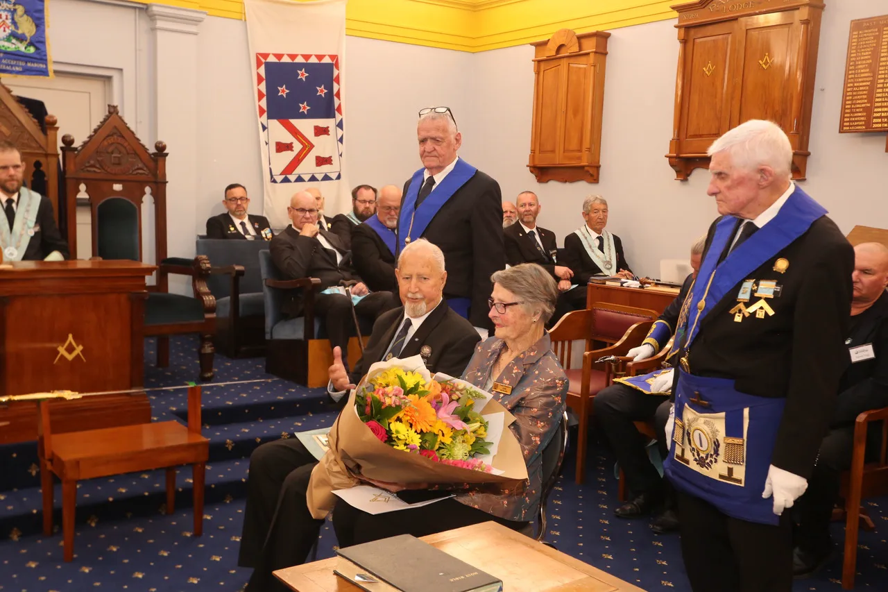 Graham Richards and his wife with their bouquet