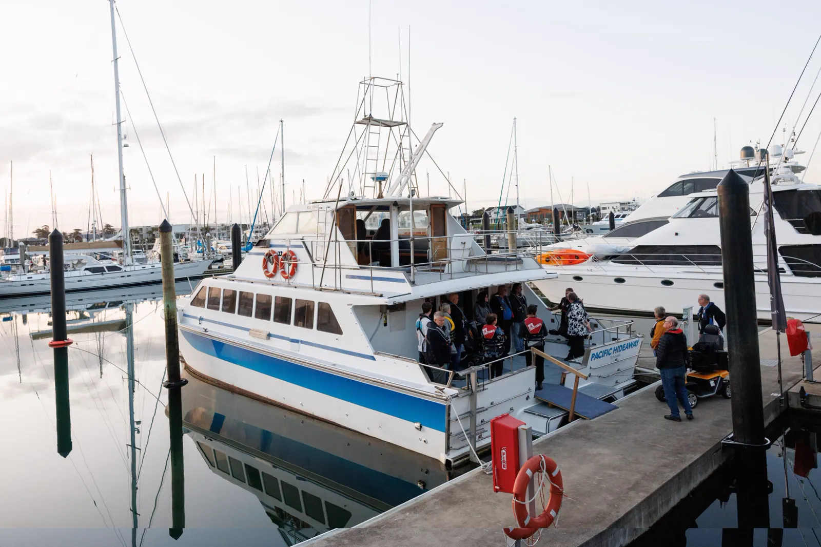 Participants boarding the Access to Adventure catamaran at Marsden Cove Marina